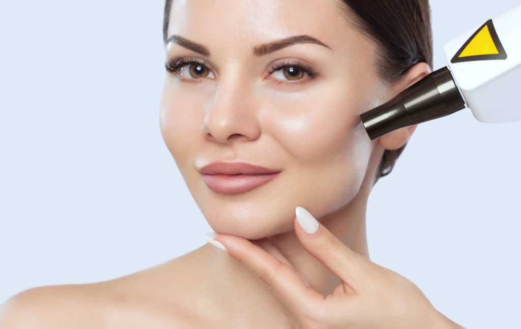 CO2 laser skin resurfacing procedure in a beauty salon. Hardware cosmetology treatment.