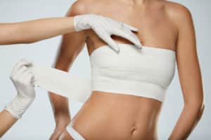 Female Body In White Panties And Breast Bandages